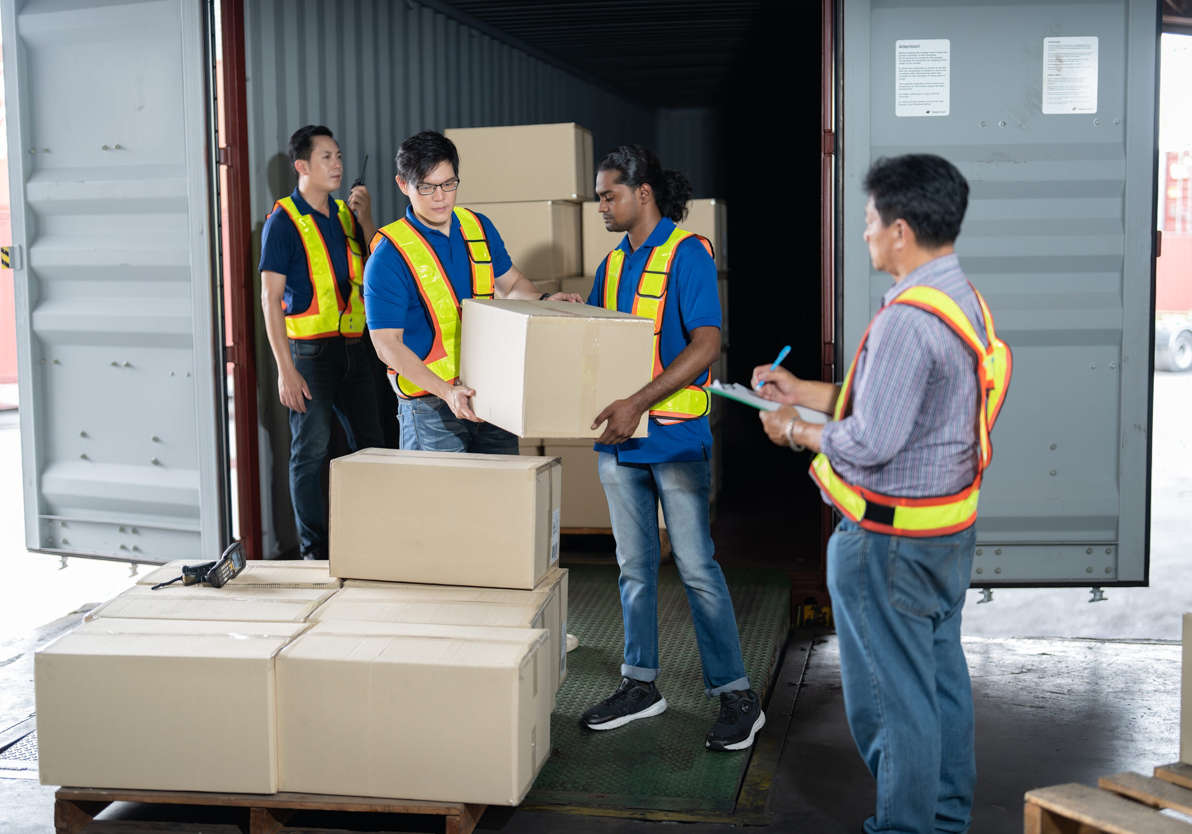 Workers open steel 40 feet container doors carry box supervisor standing check paper checklist